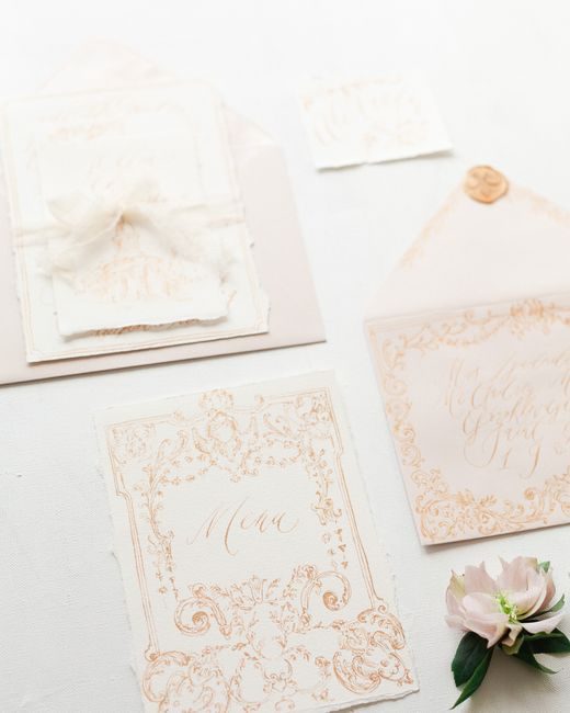 Chic and artistic wedding invitation suite featuring floral embellishments in a classic style.