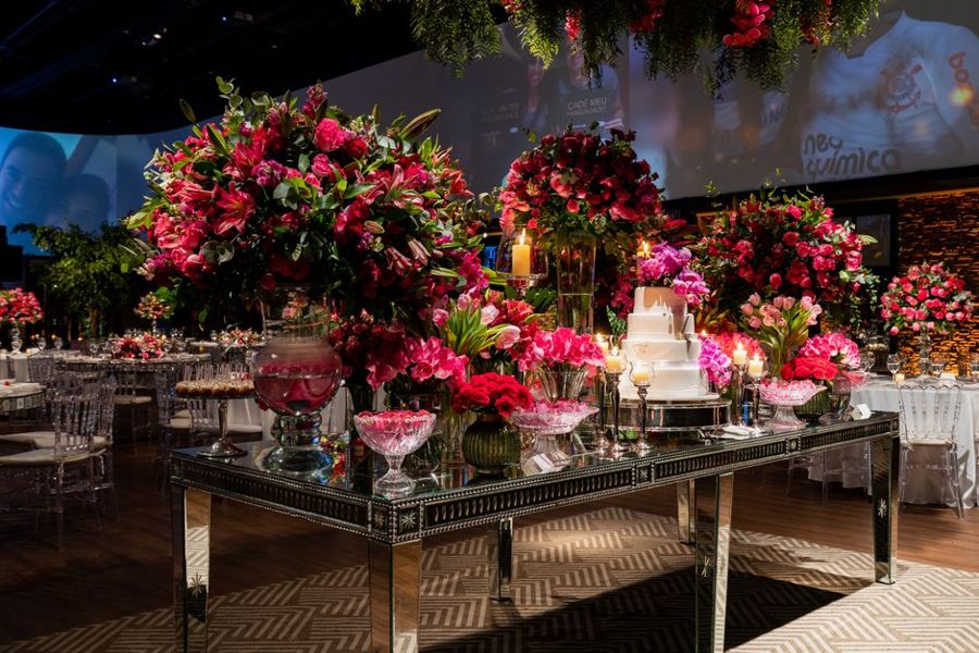 Opulent wedding reception with lush floral arrangements and elegant table setting for a memorable celebration.