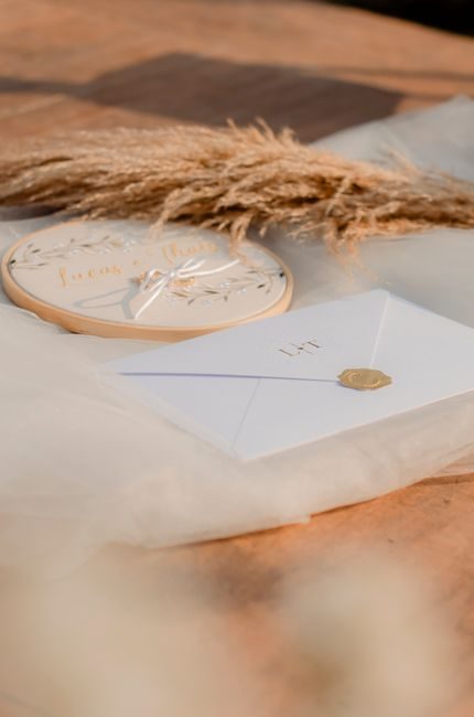 Elegant wedding invitation with pampas grass and decorative plate - perfect for rustic wedding themes.